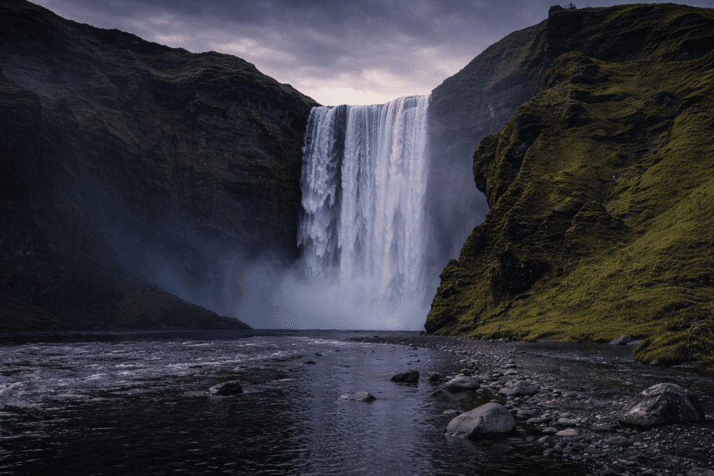 Skógafoss waterfall in Iceland – South Coast landscape with river and cliffs